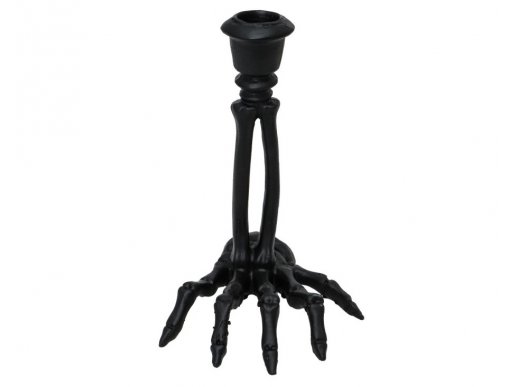 Black candle stick in the shape of skeleton hand