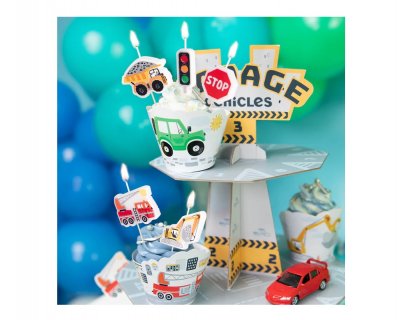 Birthday cake candles in the shape of vehicles and traffic signs
