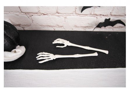 White decorative skeleton hands for Halloween party