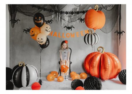 Self standing super shape foil balloon in the shape of a pumpkin in black and cream color for a Halloween party