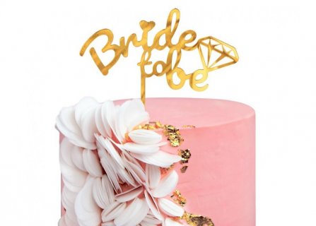 Gold acrylic cake topper with Bride to Be letters for a bachelorette party