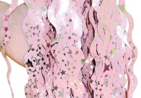 Decorative curtain in pink color with silver stars print