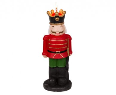 Decorative candle with the red nutcracker for Christmas