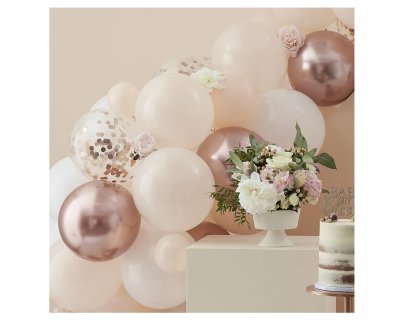 DIY latex balloon garland is peach, rose gold and white color