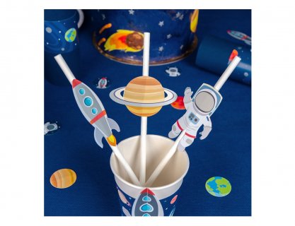 Paper straws with decorative cutouts in the shape of an astronaut, a planet and a rocket