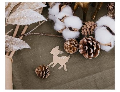 Table confetti in the shape of a deer and a tree for a Christmas party theme