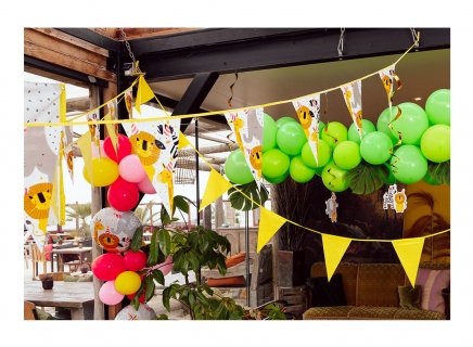 Decorative garland with plastic flags from the Fiesta Safari party collection