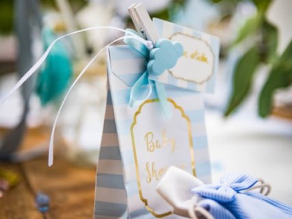 Blue stripes paper treat bags with gold baby shower print