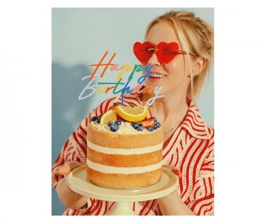 Colorful acrylic topper with Happy Birthday letters for a birthday cake decoration