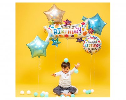 Foil balloon with glitter holographic print the stars and dots for a birthday theme party