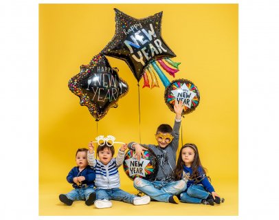 Large star shaped foil balloon with colorful tails for the New Year's Eve