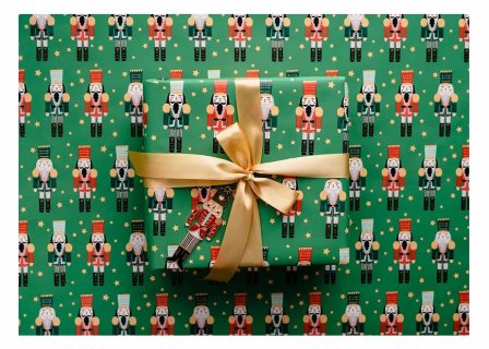 Green color wrapping paper with the nutcrackers design for Christmas gifts