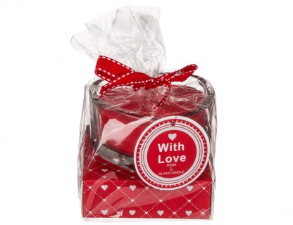 Red heart shaped candle in a glass gift for the Valentine's Day