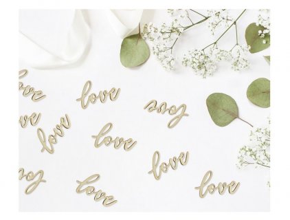 Wooden confetti for table decoration in the shape of word love