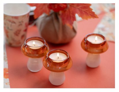 Small glass candle holder in the shape of a mushroom