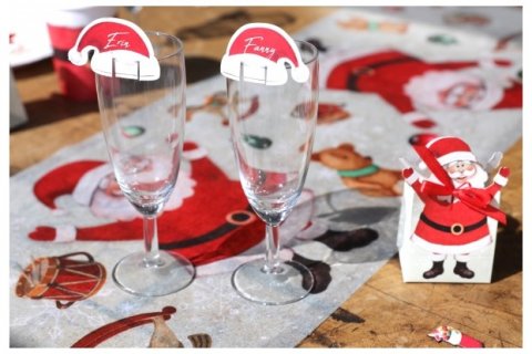 Paper glass decorations in the shape of Santa's hat for Christmas