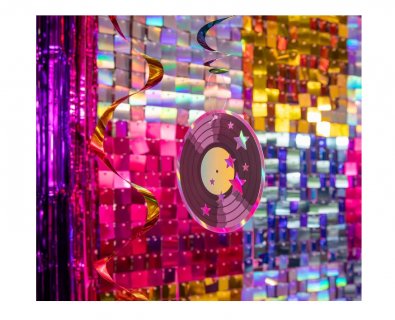 Hanging colorful swirl decorations for a Disco theme party