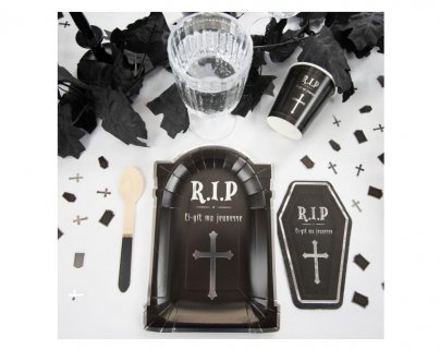 Confetti for the table decoration in the shape of a coffin, a tombstone and a Cross