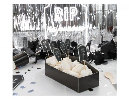 Black tray in the shape of a coffin with silver foiled details for a birthday party
