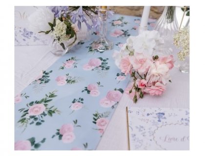 Fabric table runner with pink roses deisgn on a blue font