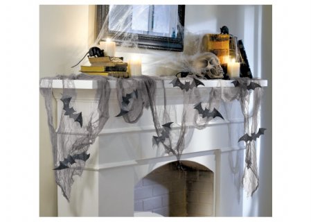 Decoration set for Halloween with grey draping gauze and black bats