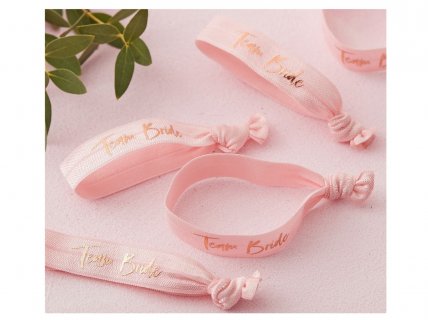 Wristbands for the Team of the Bride in pink color with rose gold foiled details