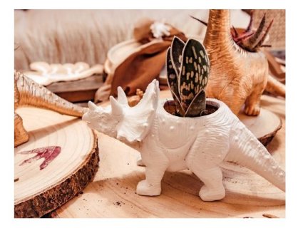 Decorative pot in white color and in the shape of a triceratops