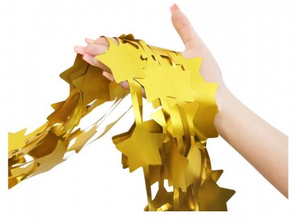 Decorative foil curtain in gold color with stars