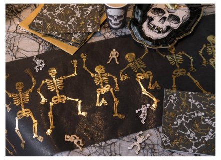 Black fabric table runner with skeletons gold metallic print for a Halloween party