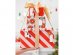 Wrapping paper in red color with small gold stars print for gift packaging