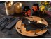 Black paper plates in the shape of a bat for Batman or Halloween theme party