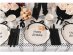 Large plates in creme color with a black bow design for a birthday theme party
