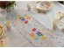 Decorative fabric runner for a birthday party table decoration with colorful print