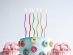 Tall and thin swirl shaped cake candles in various metallic colors
