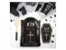 Black paper plates in the shape of a tombstone for a birthday party