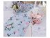 Fabric table runner with pink roses deisgn on a blue font