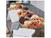 Large serving platter with napkins, table confetti and a tent card