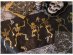 Black fabric table runner with skeletons gold metallic print for a Halloween party